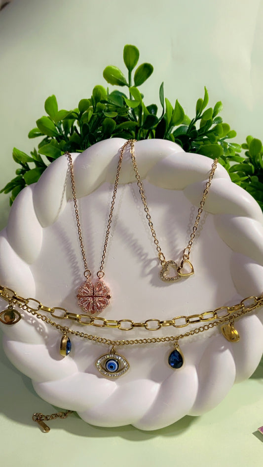 A Gift Of Warmth Combo for her ( 1 Magnetic Clover transform Rose Gold Necklace , 1 Double Heart Love Spark Necklace , 1 Gold Evil Eye Charm Bracelet ,1 set of Butterfly and Luxe Earrings , 1 Love Card , 1 Hershey Kisses